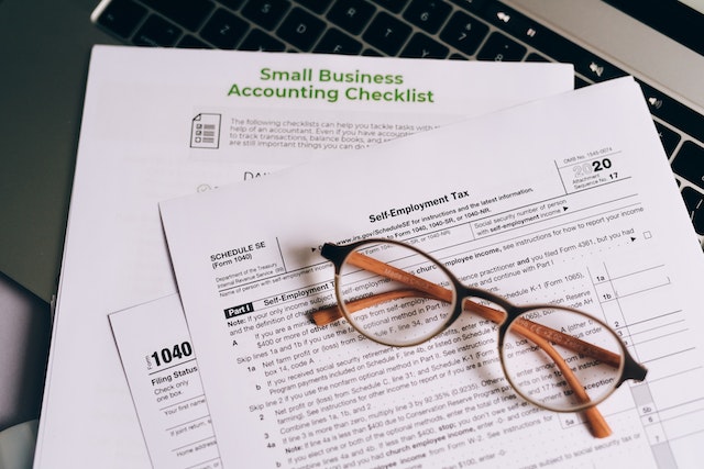 tax paperwork and a pair of glasses