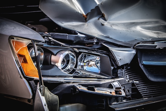 damaged headlight on gray car